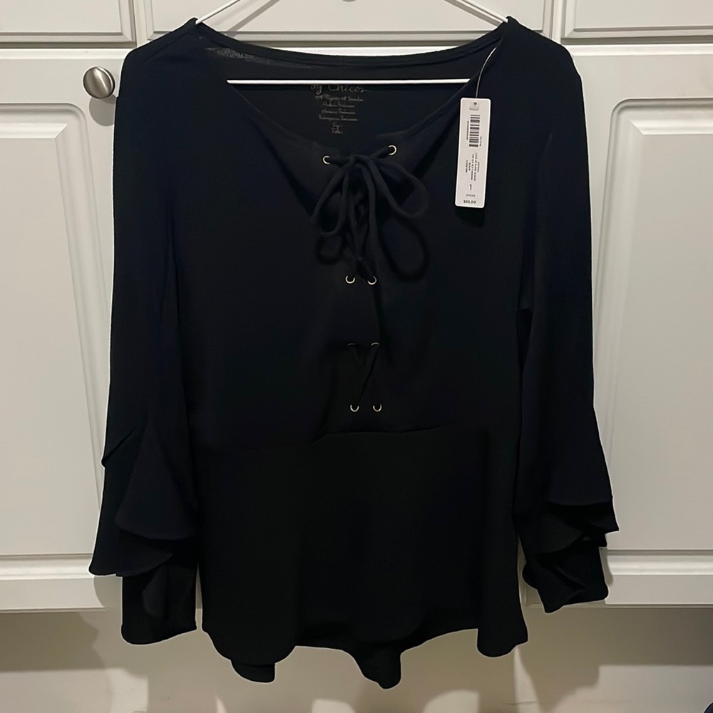 Womens size 2 tunic, Long sleeve ruffle at bottom of sleeve lace up front.